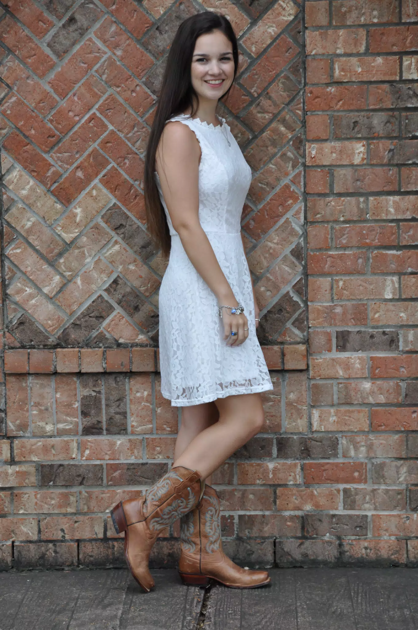 Emily in White Dress by Brick Wall