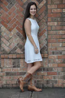 Emily in White Dress by Brick Wall