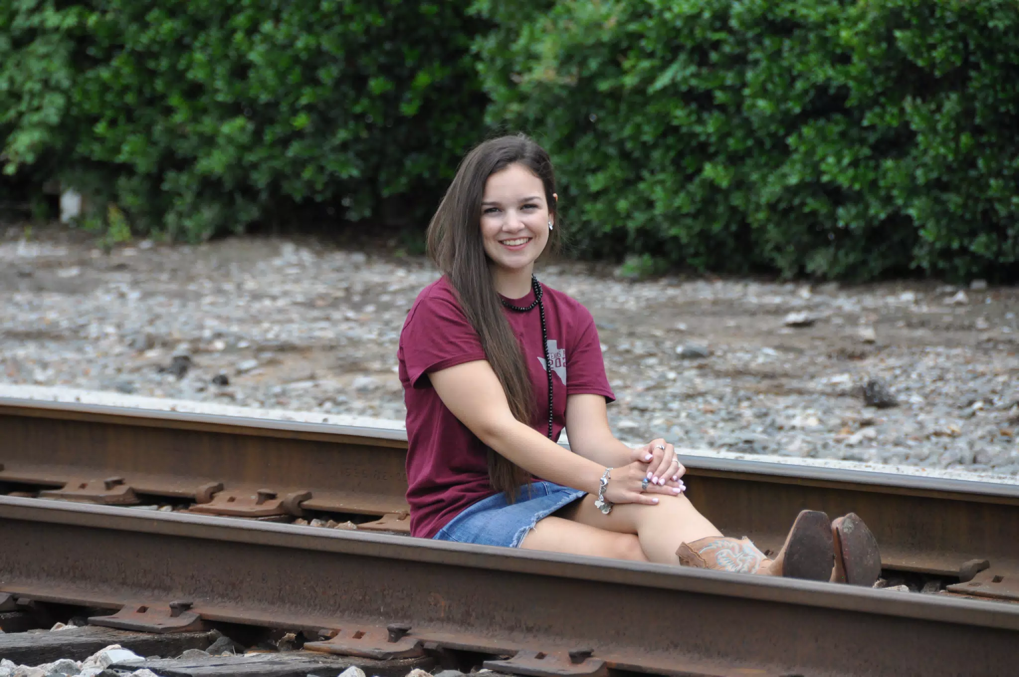 Teen Posing on Railroad Tracks in Skirt and Boots