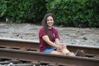 Teen Posing on Railroad Tracks in Skirt and Boots