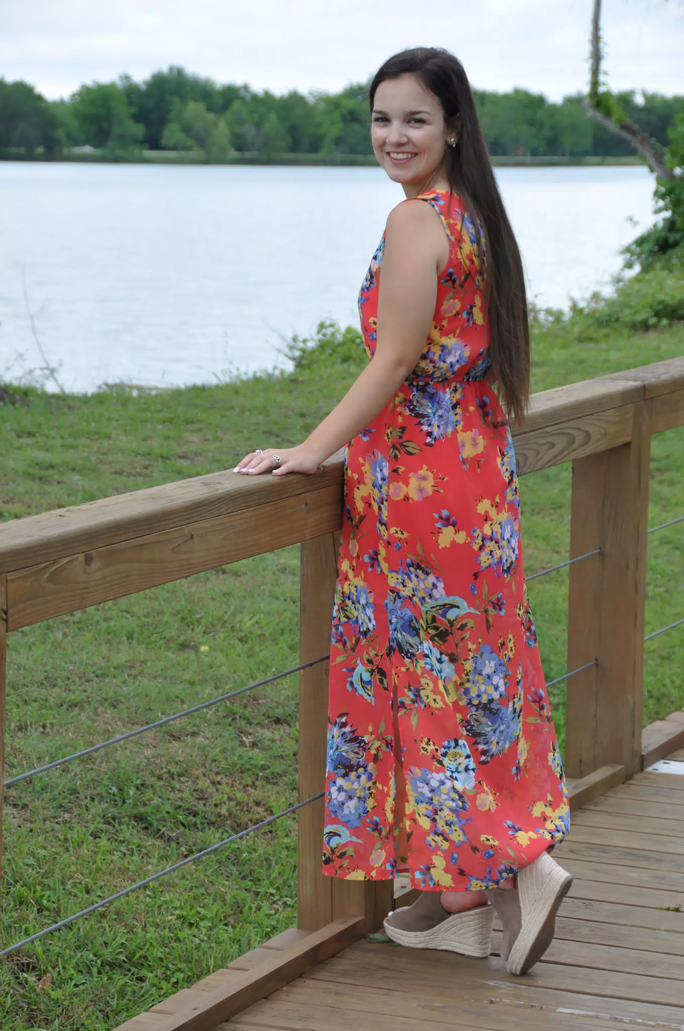 Brunette Teen Model in Red Dress and Wedges at Railing by Pond