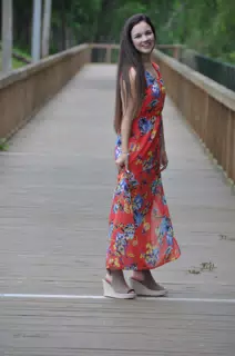 Teen Brunette Model in Red Dress on Boardwalk by Pond in Texas