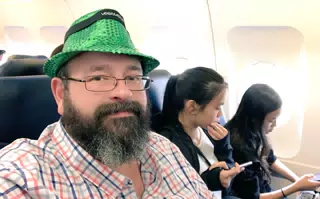 Green Fedora Selfie on Plane