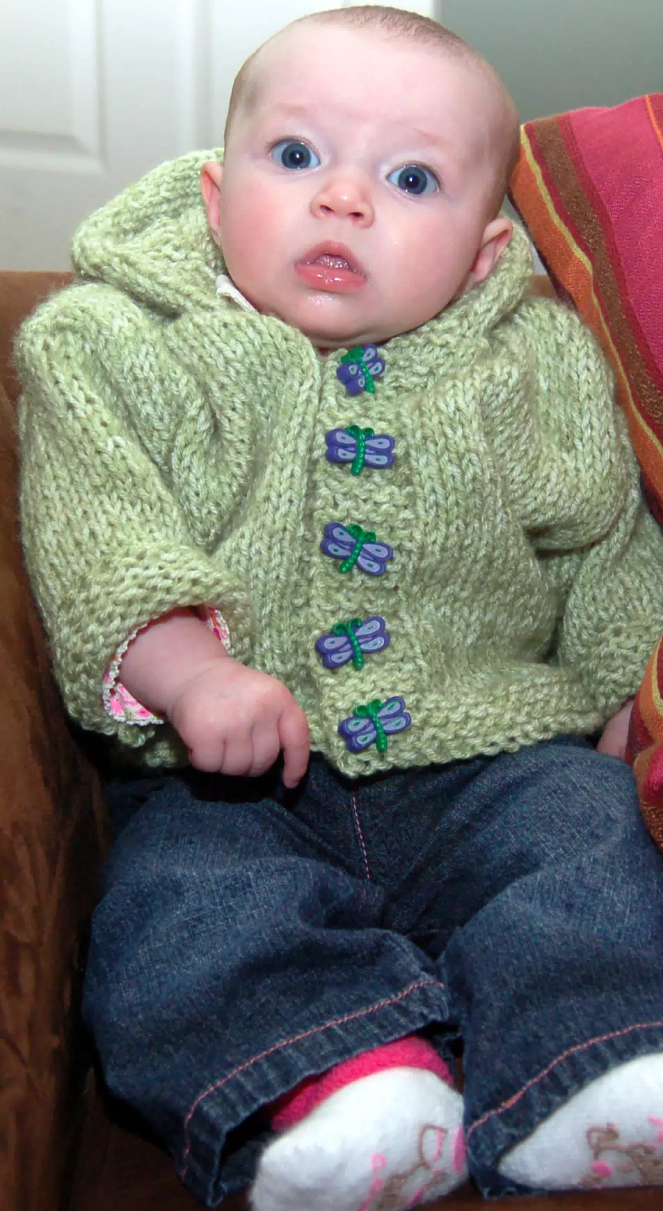 Liesl on Loveseat with Green Sweater