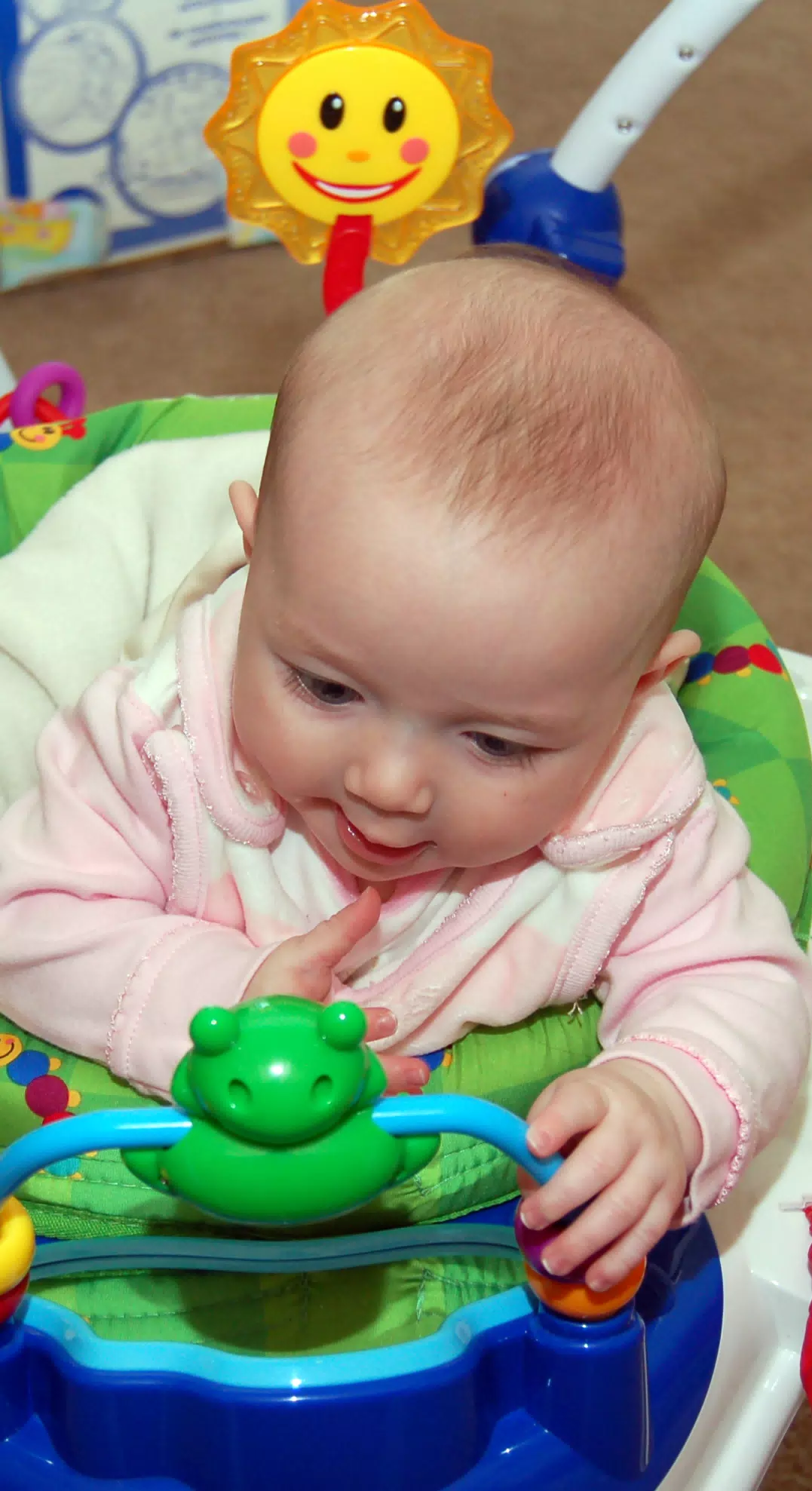 Liesl in Her Bouncer with Mr Frog and Mr Sun