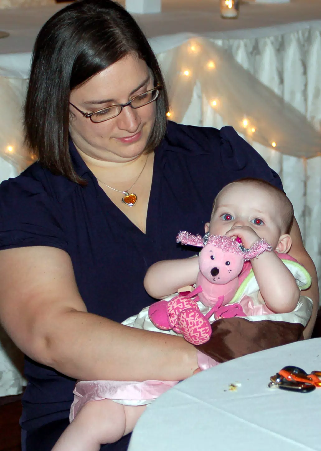 Dominica Holding Liesl at Table