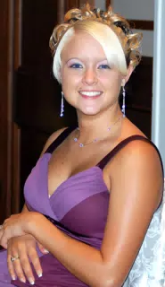 Monica Lillie Sitting at Head Table