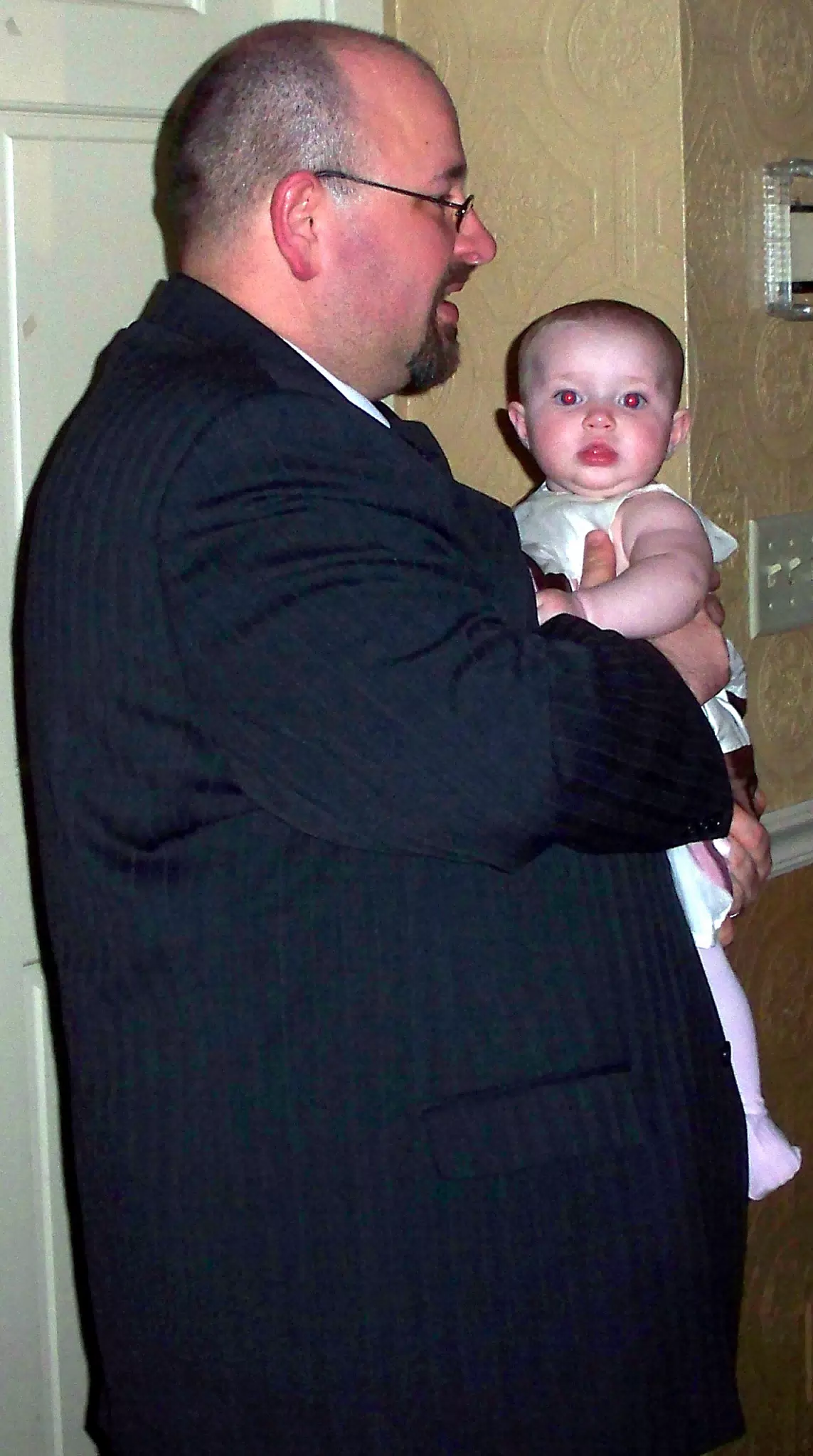 Scott holding Liesl at Wedding