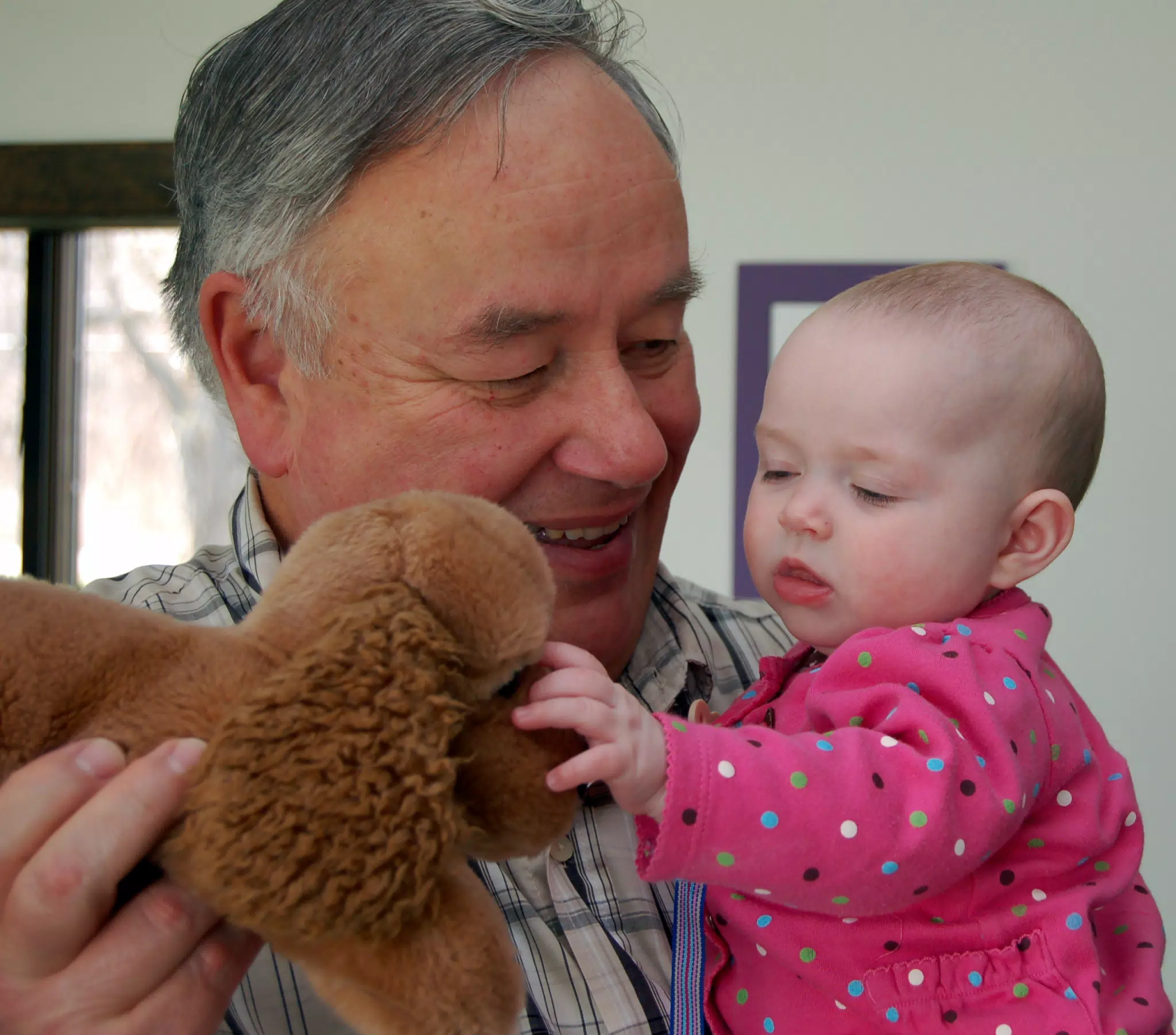Liesl with Stuffed Cocker Spaniel and Grandpa Miller
