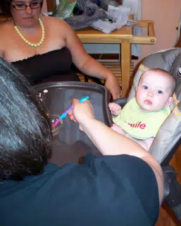Dominica and Francesca Feeding Liesl