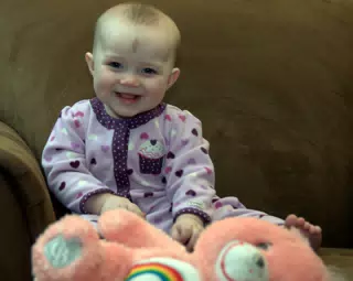 Liesl Smiling Over Cheer Bear