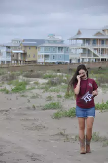 Emily Putting on Sunglasses on the Beach on Galveston Island