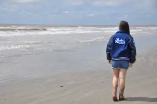 Girl Walking on Galveston Beach