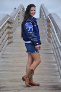 Emily on Galveston Beach Boardwalk in Cowgirl Boots, Letterman Jacket, and Jean Skirt