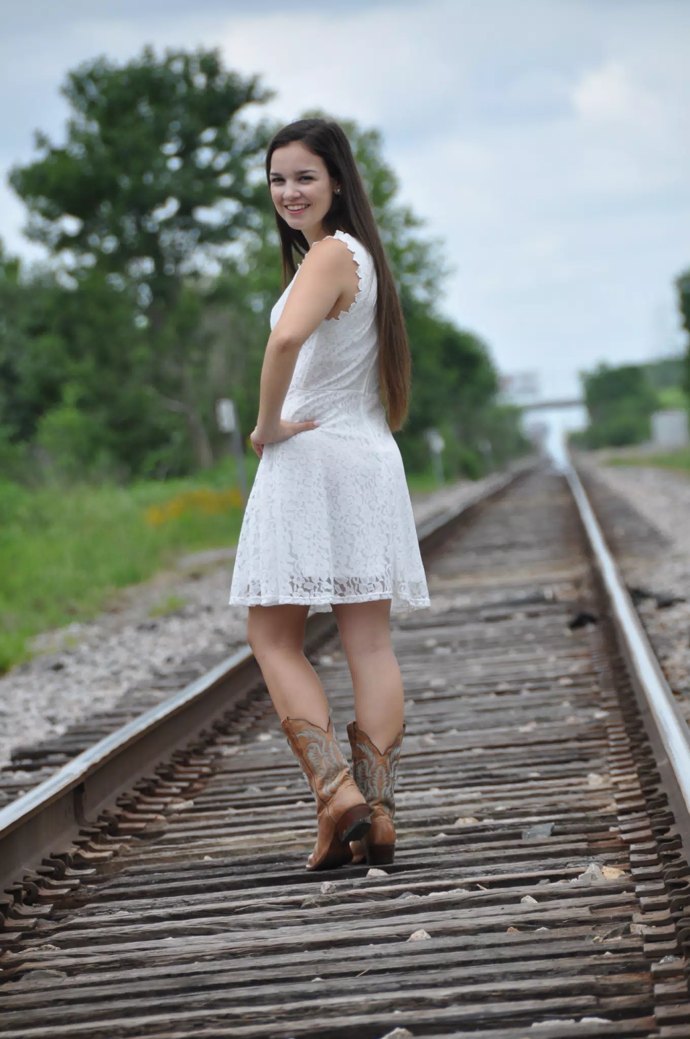 Cute Model in White Dress on Train Tracks