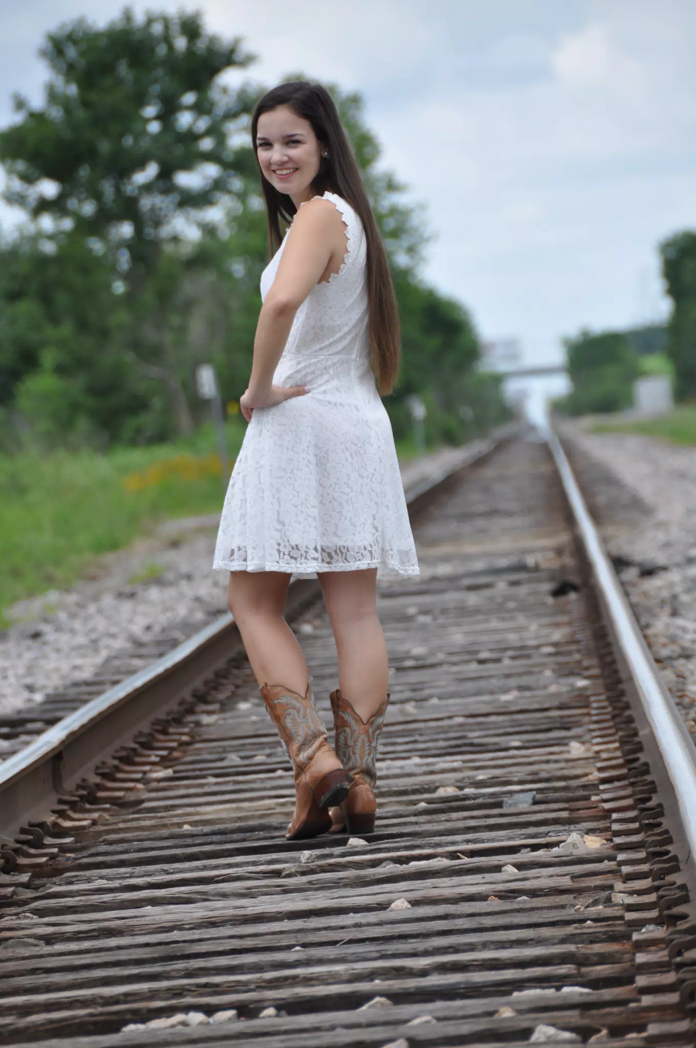 Girl Looking Over Her Shoulder on Train Tracks