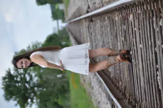 Girl Looking Over Her Shoulder on Train Tracks