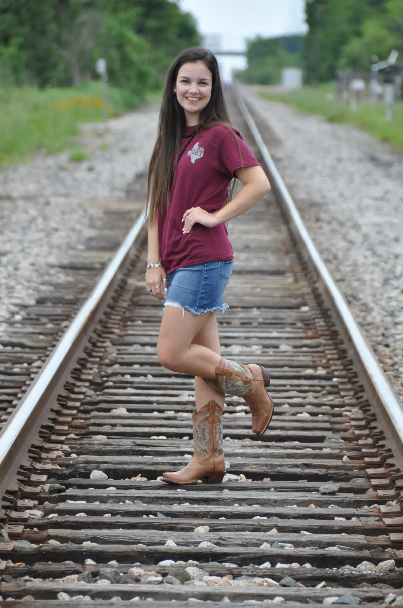 Emily in Miniskirt on Railroad Tracks with Cowgirl Boots