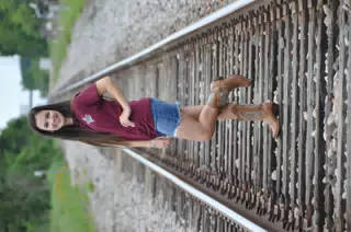 Emily in Miniskirt on Railroad Tracks with Cowgirl Boots
