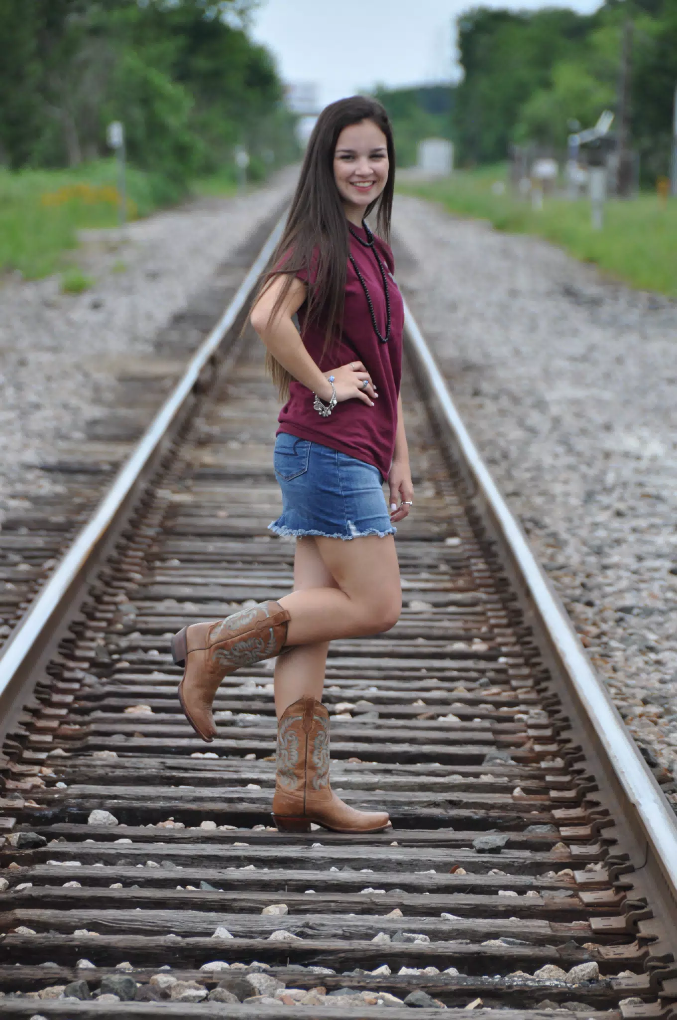 Brunette Teen Model on Train Tracks in Skirt and Boots