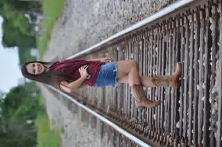 Brunette Teen Model on Train Tracks in Skirt and Boots