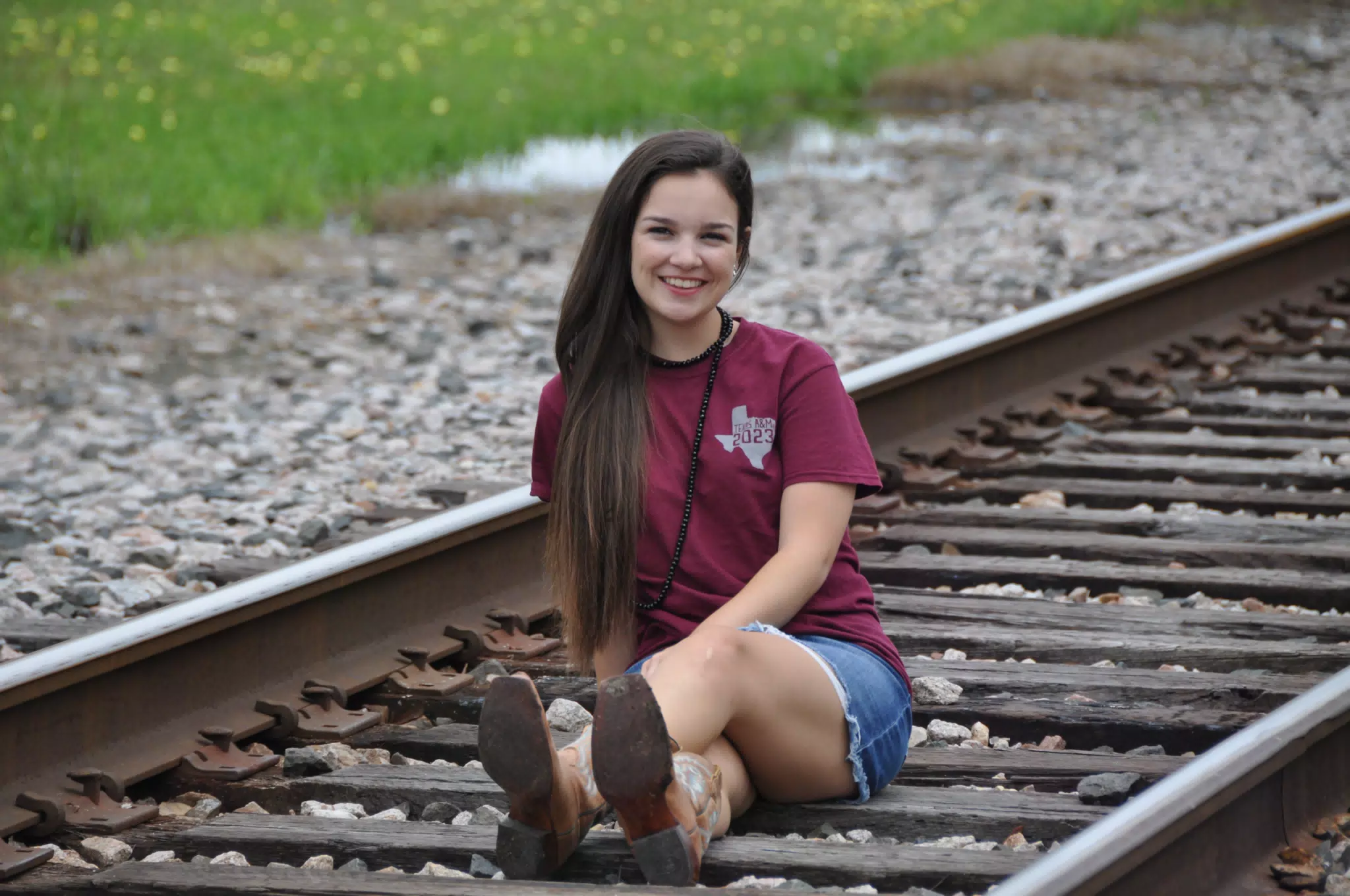 Emily Modeling on Railroad Tracks in Texas with Miniskirt and Cowgirl Boots