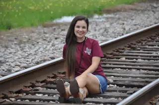 Emily Modeling on Railroad Tracks in Texas with Miniskirt and Cowgirl Boots