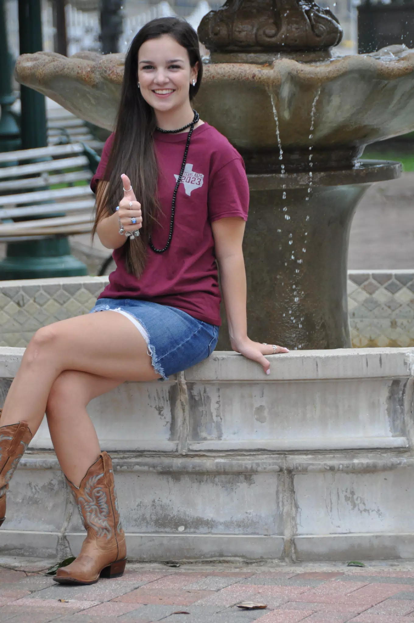 Emily Giving Thumbs Up from Fountain