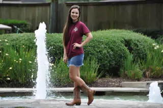 Emily Posing by Fountain in Denim Skirt