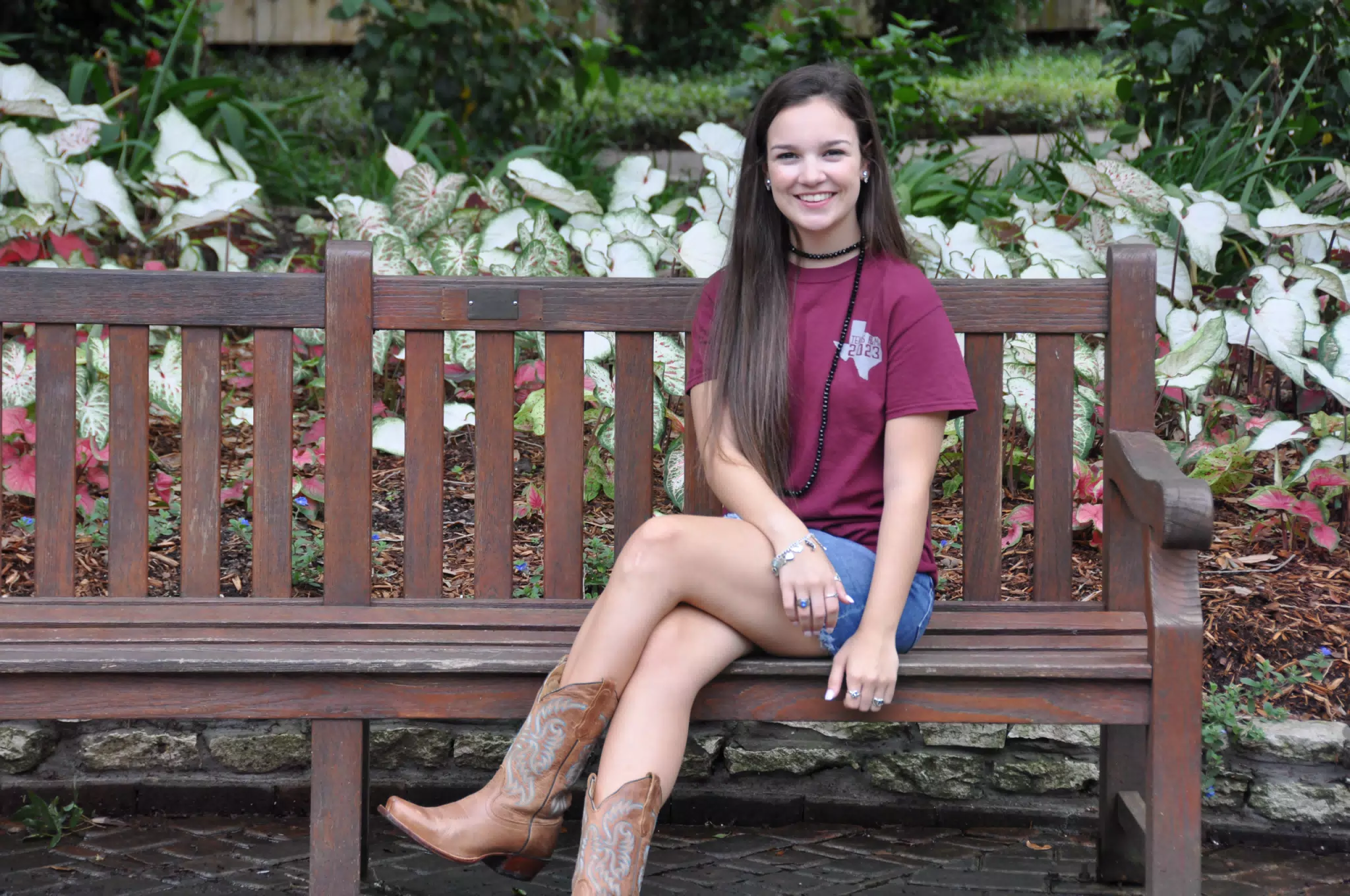 Emily in Skirt on Park Bench with Cowgirl Boots