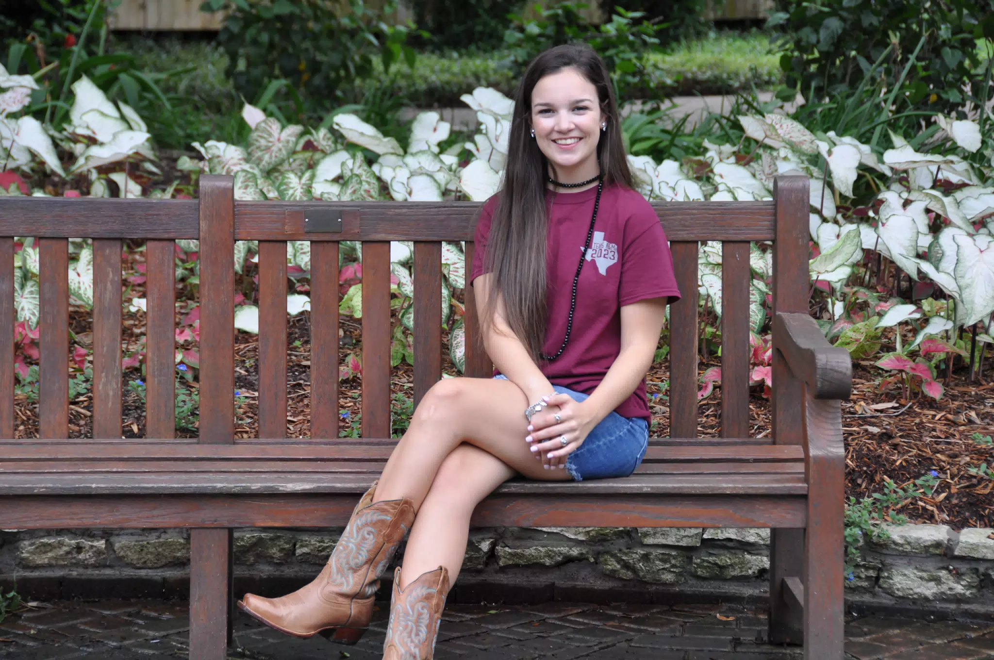 Emily on Park Bench in Denim Skirt and Cowgirl Boots
