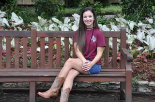 Emily on Park Bench in Denim Skirt and Cowgirl Boots