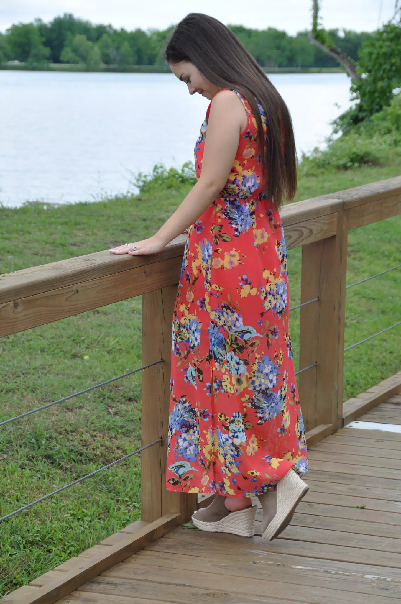 Emily by Railing by Pond in Red Dress