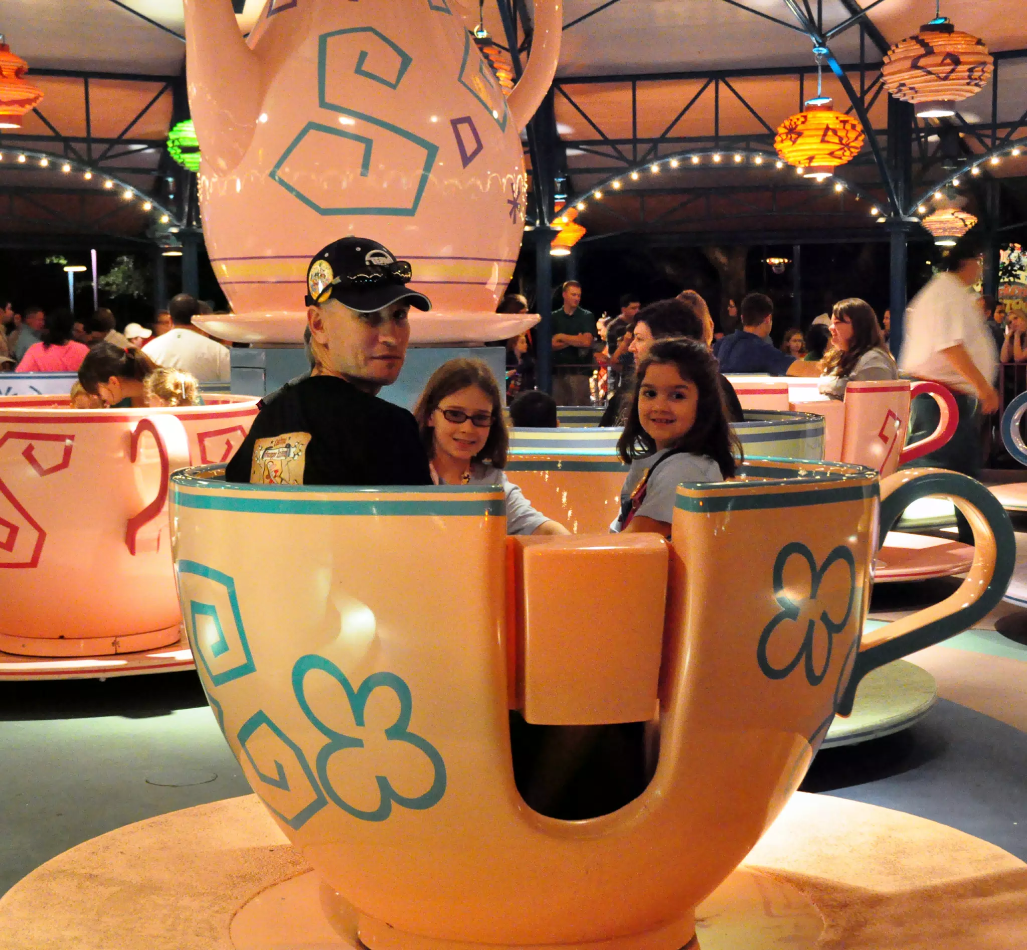 Bennie and the Girls Prepare to Ride the Teacups