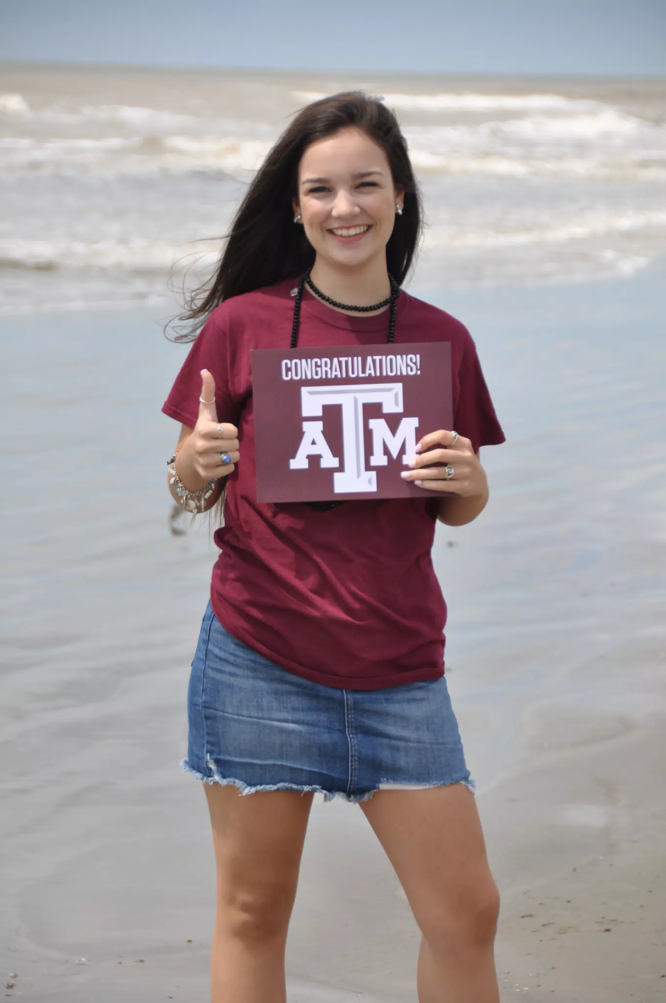 Girl on Beach with Texas A&M Sign
