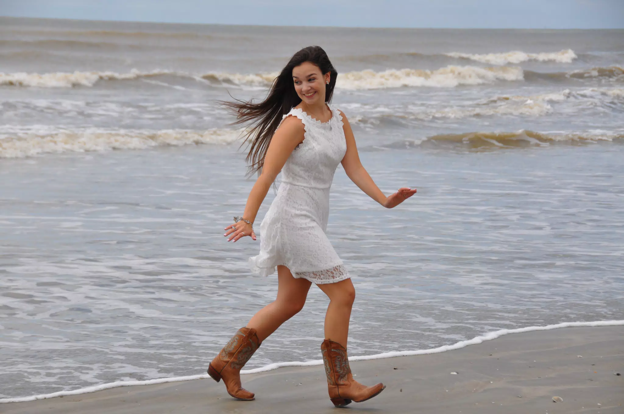 Emily Running from the Water in Cowboy Boots and White Dress on Galveston Beach