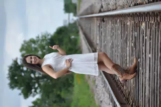 Emily in White Dress on Railroad Tracks