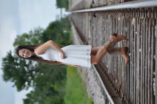 Laughing Brunette Model in White Dress and Cowboy Boots