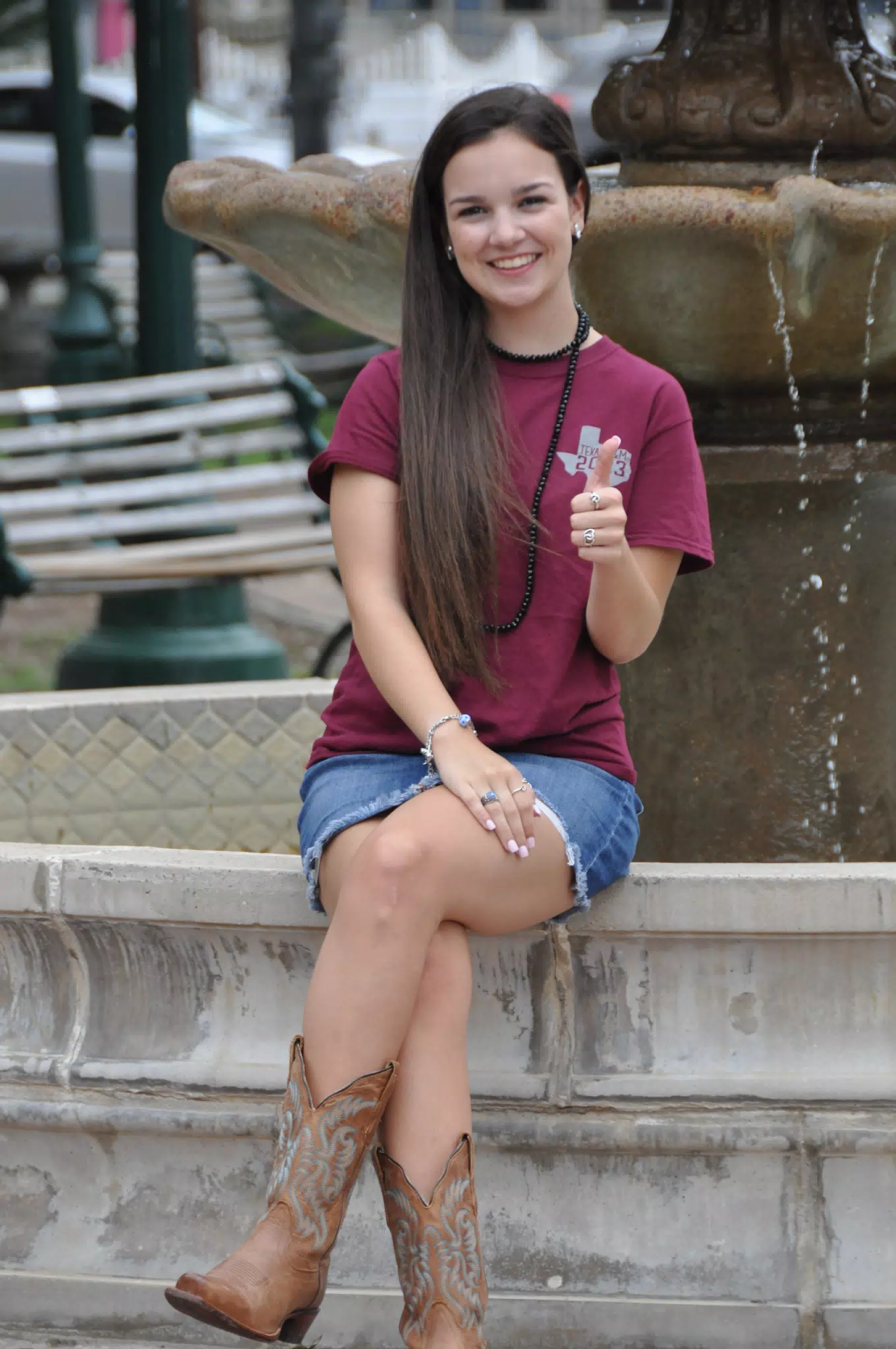 Emily Thumbs Up on Fountain