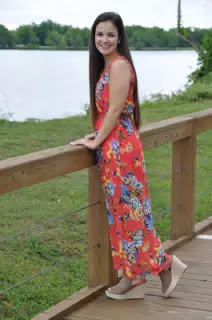 Brunette Model in Red Floral Dress by Pond in Texas