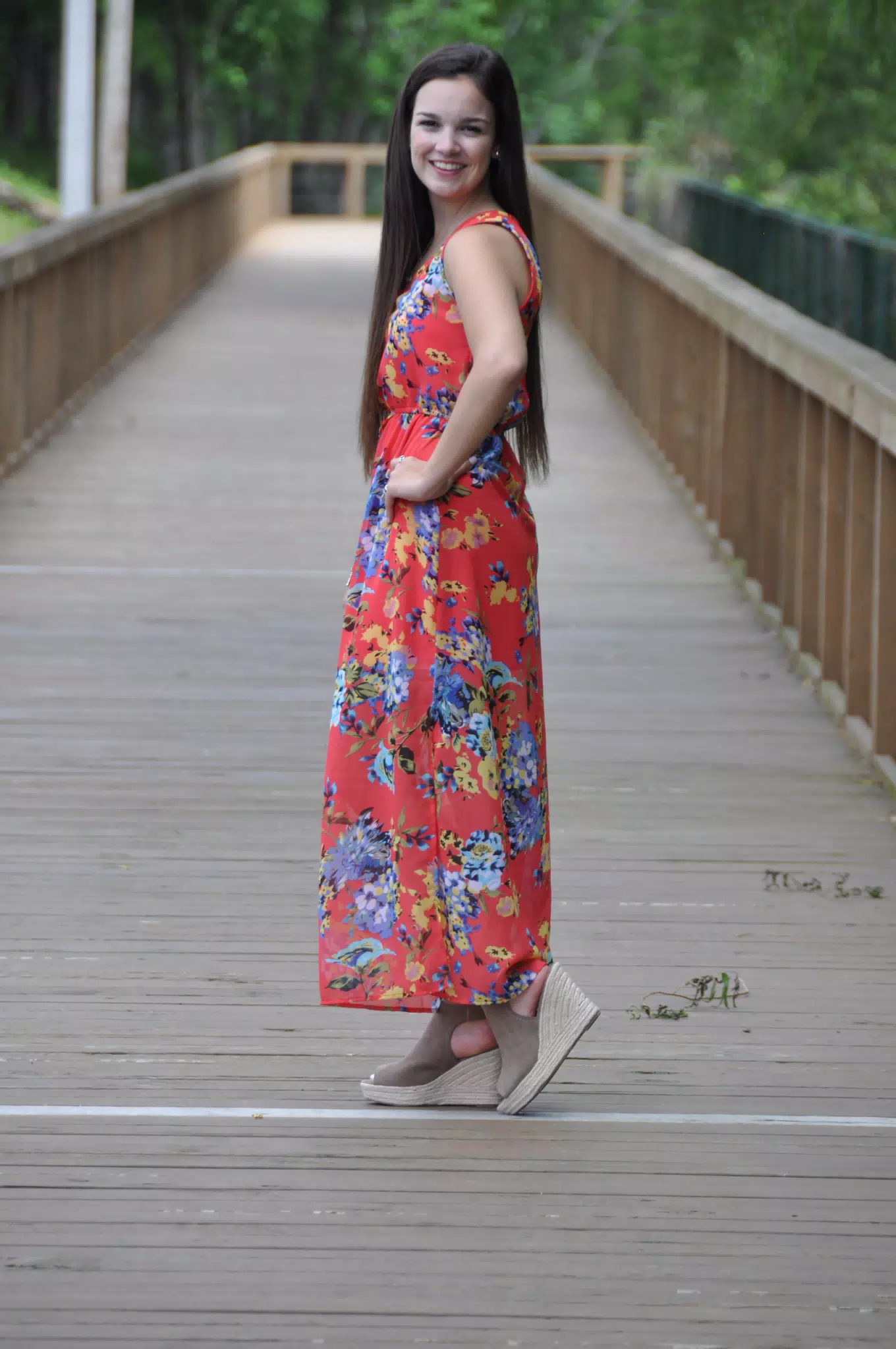 Long Haired Brunette Model in Wedges and Red Dress