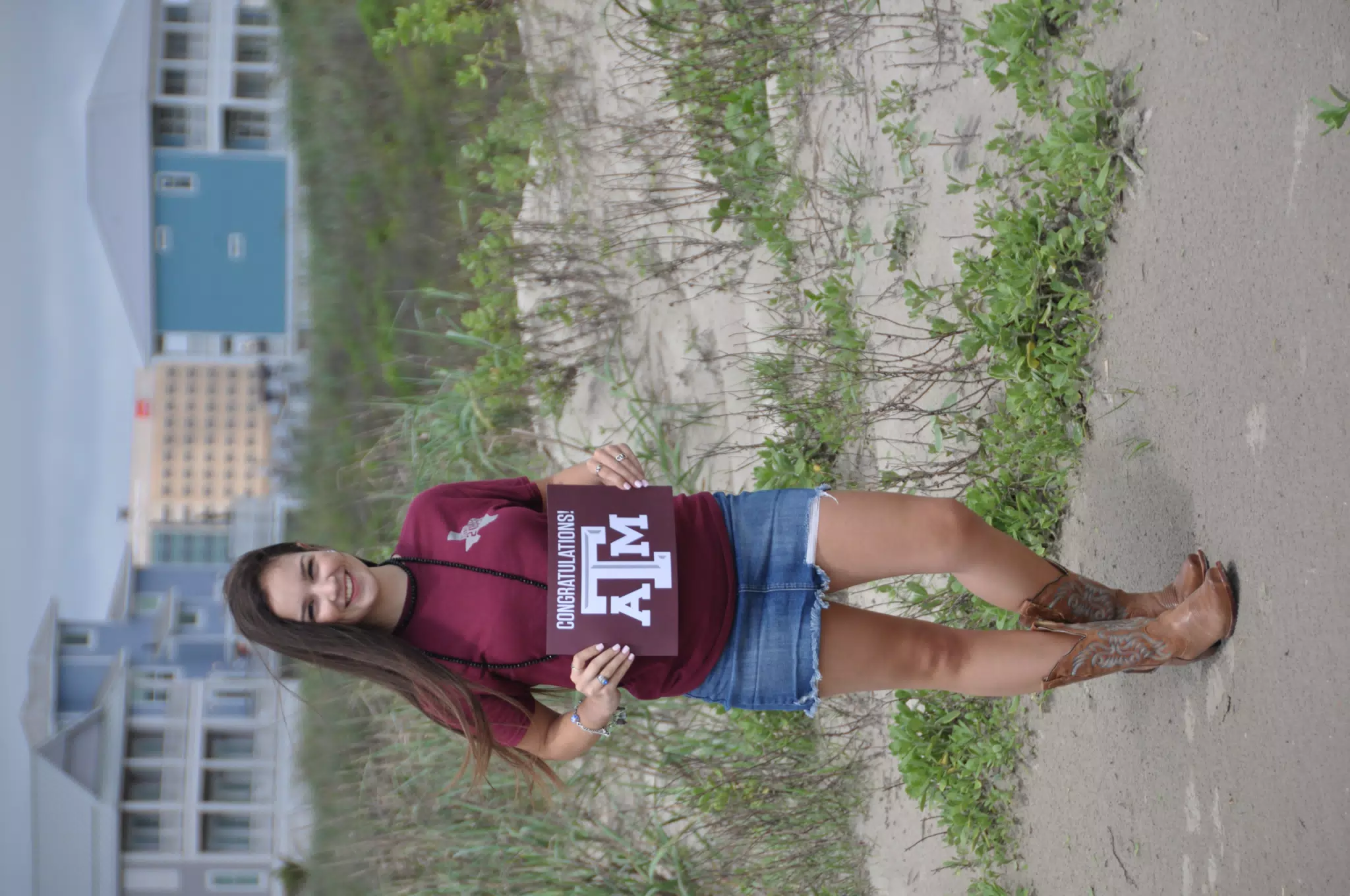 Emily on Galveston Beach in Skirt with Aggie Sign