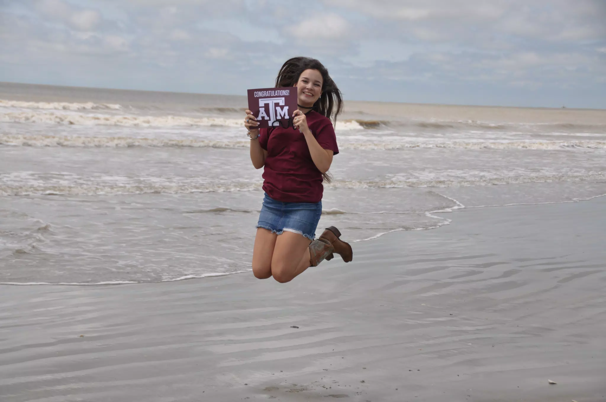 Texas A&M Teen Jumping on Beach