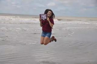 Texas A&M Teen Jumping on Beach