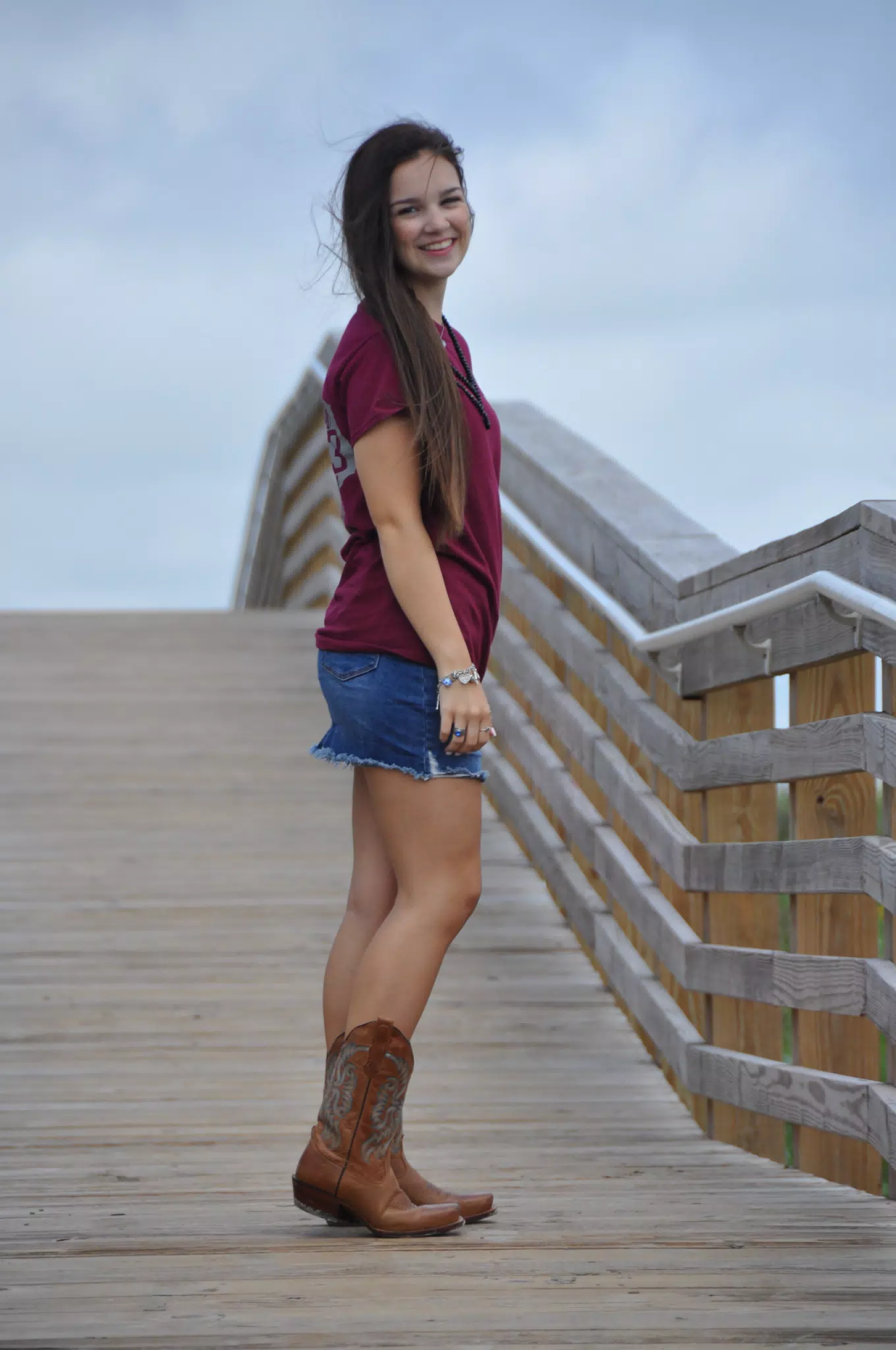 Emily Modeling on Galveston Boardwalk in Cowgirl Boots, Denim Skirt and Tee Shirt