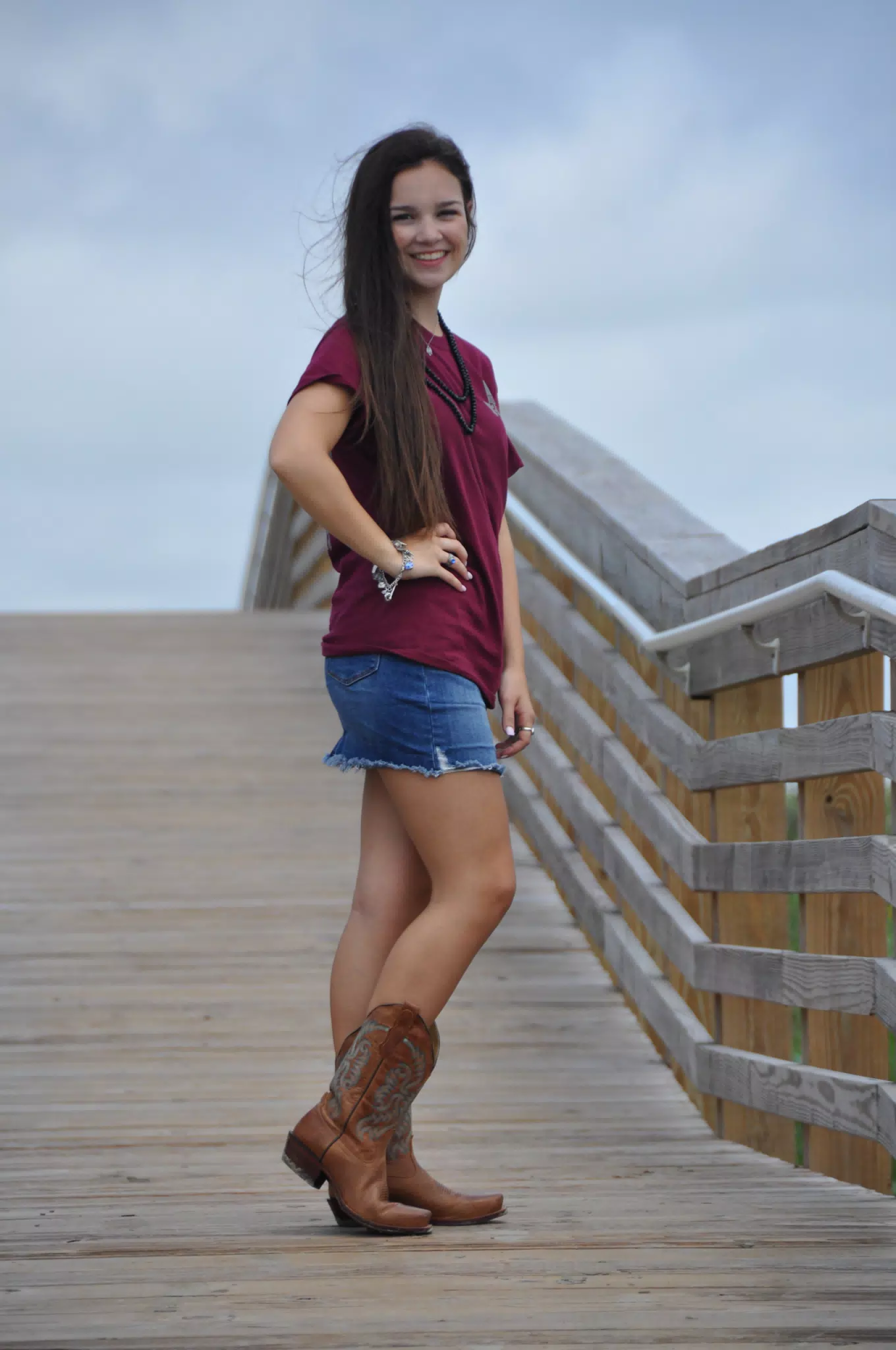 Girl on Galveston Boardwalk in Cowgirl Boots