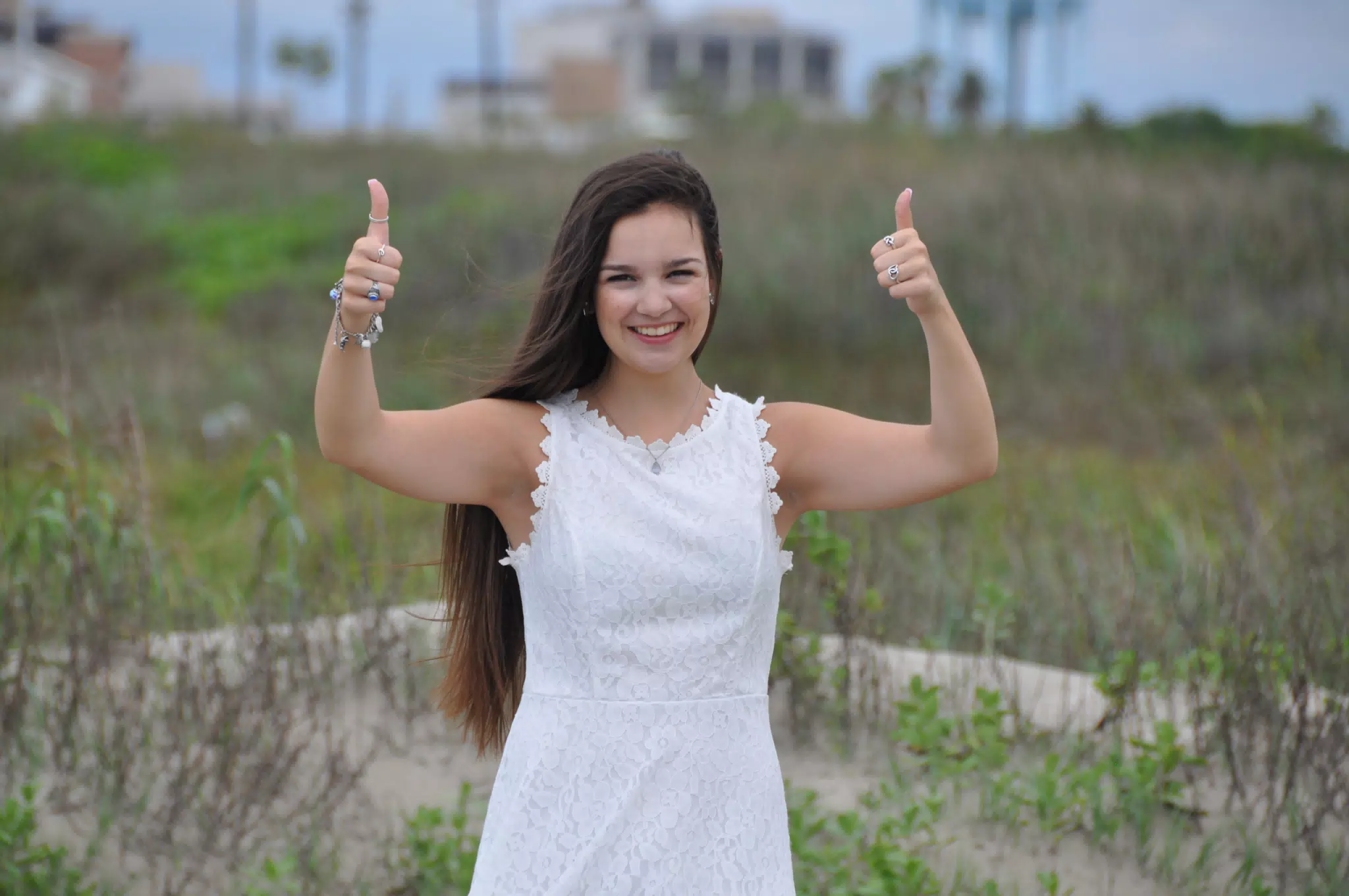 Emily Thumbs Up in White Dress