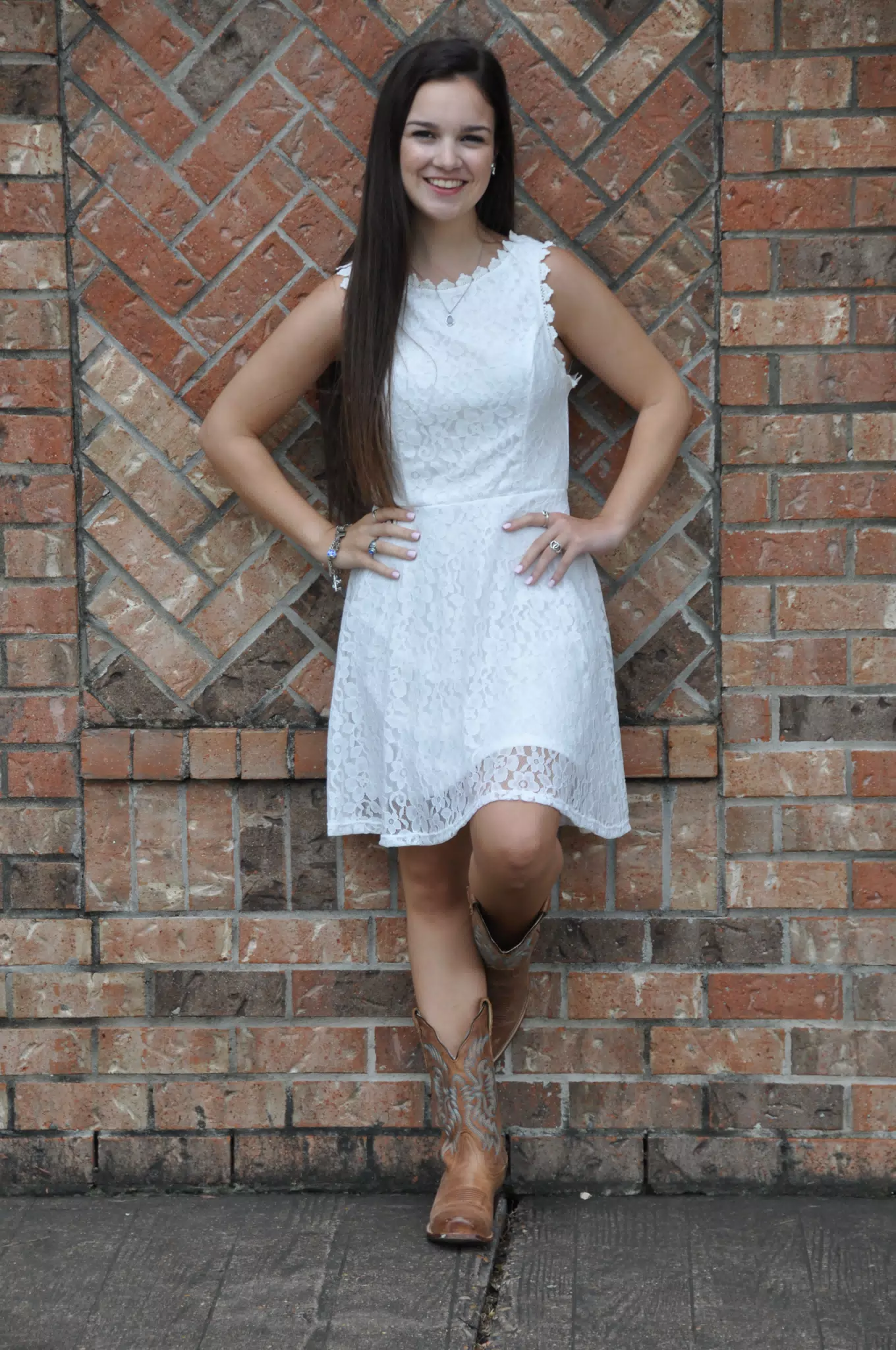 Girl in White Dress on Brick Wall