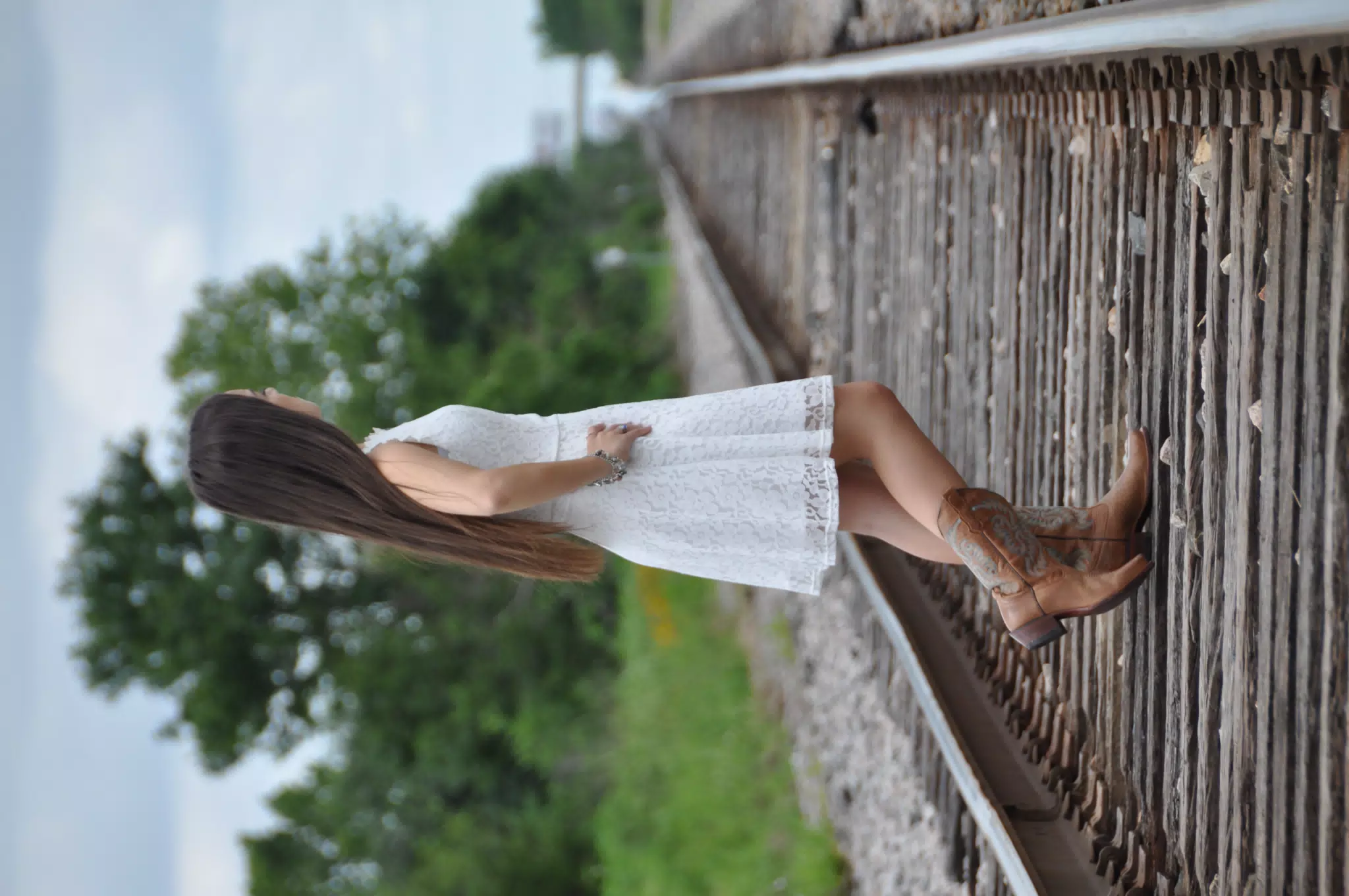 Model in White Dress Looking. Away