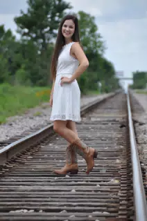 Emily in White Dress on Train Tracks